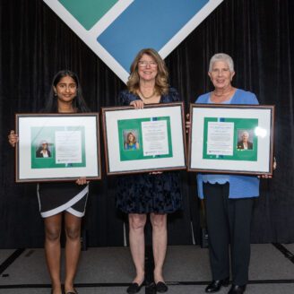 3 women holding Wertheimer award plaques