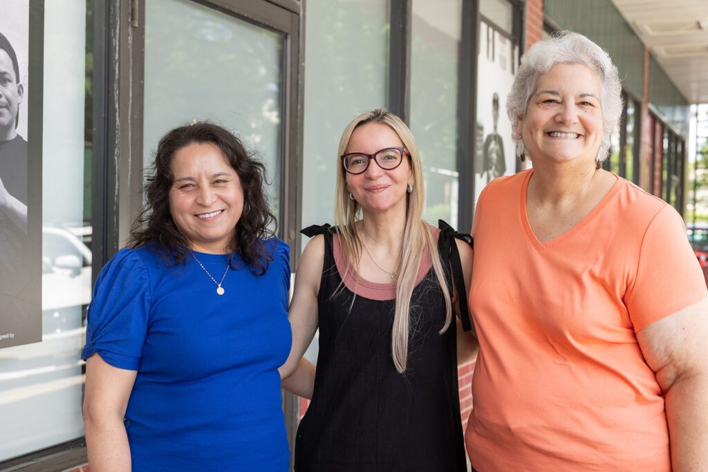 Soledad poses with Centro Hispano Case Manager Liz Matus and Co-Founder and former Director Maria Teresa Shuck