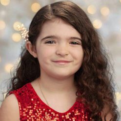 smiling girl in red dress