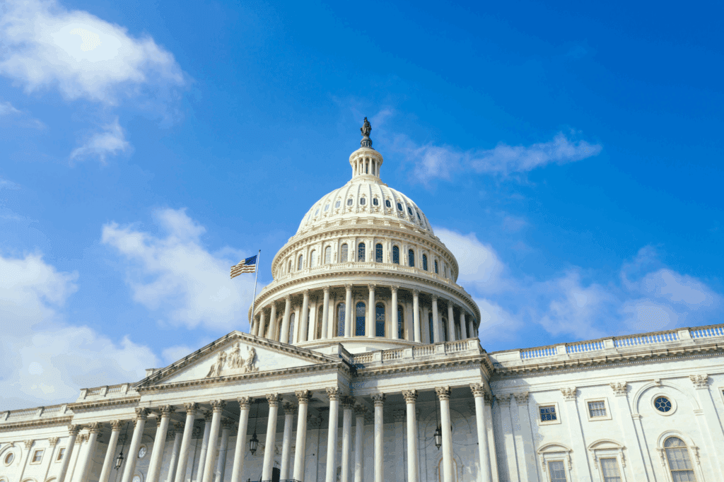 Capital Dome exterior image with an American flag waving in the wind